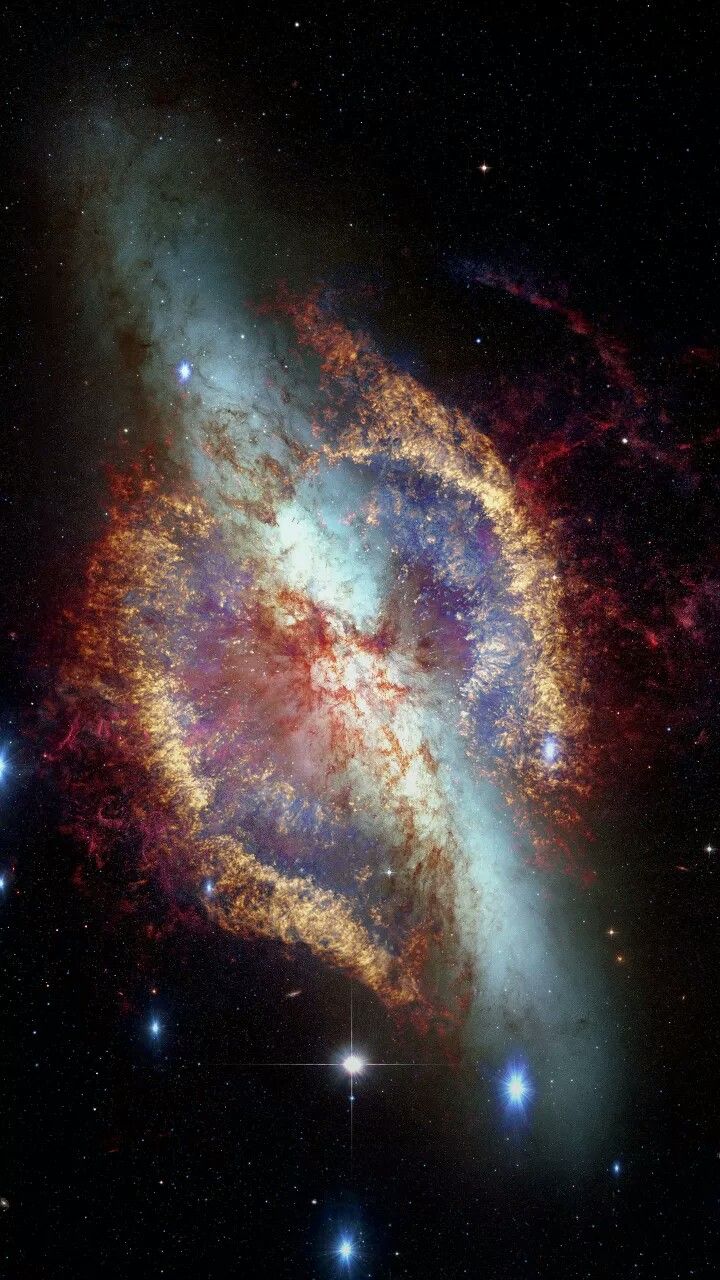 an image of a spiral galaxy in the sky with stars around it and bright colors