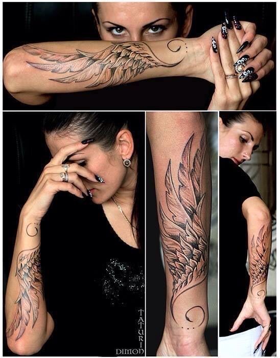 a woman with many tattoos on her arm and arms, both showing the wings in different positions