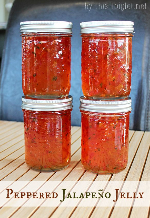 three jars of peppered jalapeno jelly sit on a table