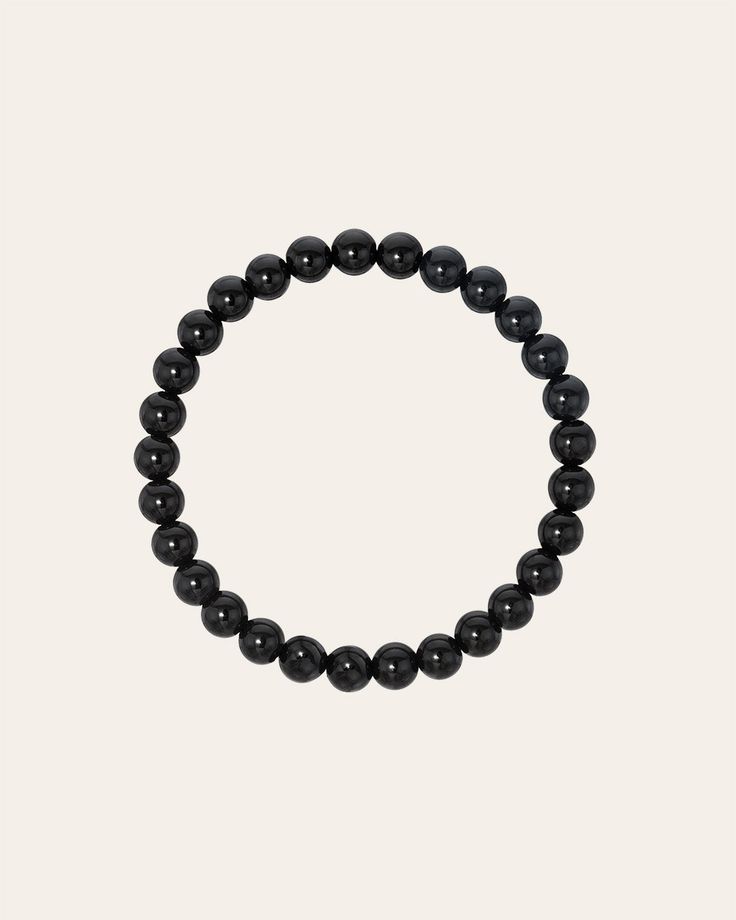 Part of our bead collection, is this fun and chic 6mm black onyx bead bracelet. With an elastic stretch fit, wear it up or down by itself or stacked with your other fine and fashion bracelets for the perfect arm party. Made in L.A. Stretch Fit Black onyx hollow beads Ships in 3-6 business days Rush orders ship in 2-4 business days Comes carefully packaged in a branded Zoe Lev protective sleeve. This item is Final Sale. See here for details. Classic Black Beaded Bracelets, Classic Black Bracelets With 8mm Beads, Minimalist Black Hand-strung Beaded Bracelet, Minimalist Black Hand-strung Beaded Bracelets, Minimalist Black Stretch Bracelet With Round Beads, Minimalist Hand-strung Black Beaded Bracelets, Casual Black Stretch Bracelet With 8mm Beads, Casual Black Stretch Bracelet With Gemstone Beads, Casual Black Round Stretch Bracelet