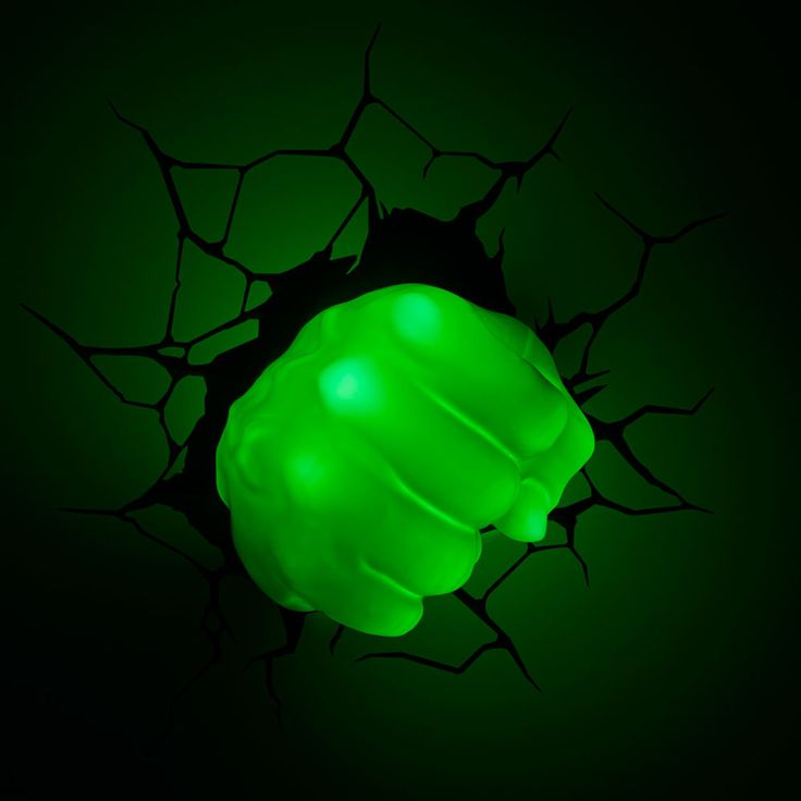 a green light that is shining in the dark with its arms and hands extended out