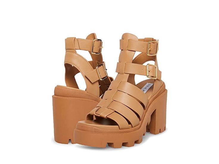 Steve Madden Cosmic Sandal - Women's Shoes : Tan : Elevate your warm weather style this season in the 90s-inspired Steve Madden Cosmic Sandal. Ankle strap with buckle closure. Round, open toe silhouette. Chunky lug sole. Vegan leather upper. Vegan leather lining. Synthetic insole and outsole. Imported. Measurements: Heel Height: 4 1 4 in Platform Height: 1 1 2 in Product measurements were taken using size 7, width M. Please note that measurements may vary by size. Weight of footwear is based on Trendy Strapped Sandals For Summer, Casual Ankle Strap Sandals With Lug Sole, Synthetic Open Toe Sandals With Lug Sole, Trendy Strapped Sandals With Buckle Closure, Spring Open Toe Sandals With Lug Sole, Casual Sandals With Lug Sole For Spring, Strapped Heels With Buckle Closure For Summer, Strapped Heels With Buckle Closure, Spring Sandals With Lug Sole And Round Toe