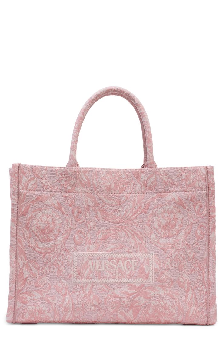 The label's signature Barocco pattern and an embroidered logo decorate this structured tote in a perfect everyday size. A removable, matching shoulder strap adds a hands-free carrying option to the classic style. Open top Top carry handles; removable, adjustable shoulder strap Exterior slip pocket Interior zip pocket Structured silhouette with flat base and protective leather feet Unlined Textile with leather trim Made in Italy Designer Handbags Elegant Bags With Embroidered Logo For Everyday Use, Elegant Top Handle Shoulder Bag With Embroidered Logo, Elegant Rectangular Bag With Embroidered Logo, Elegant Double Handle Bag With Embroidered Logo, Chic Shoulder Bag With Embroidered Logo And Double Handle, Designer Shoulder Bag With Embroidered Logo, Luxury Bags With Embroidered Logo For Shopping, Elegant Shopping Bags With Embroidered Logo, Elegant Shopping Bag With Embroidered Logo