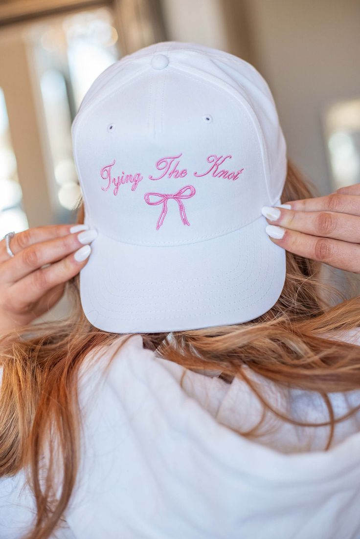 Just a little something cute for the bride to be. This white trucker hat features a pretty pink bow to tell everyone that you are getting married! White Snapback Mini Hats For Spring, Adjustable White Mini Hats For Bachelorette Party, White Curved Brim Baseball Cap For Wedding, White Baseball Cap As Spring Gift, White Baseball Cap As A Spring Gift, White Adjustable Hat For Bachelorette Party, Cute Pink Wedding Hat, White Trucker Hat, Eucalyptus Mint