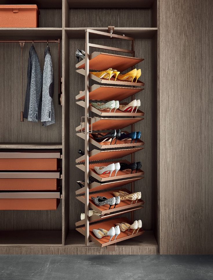 an organized closet with shoes and purses