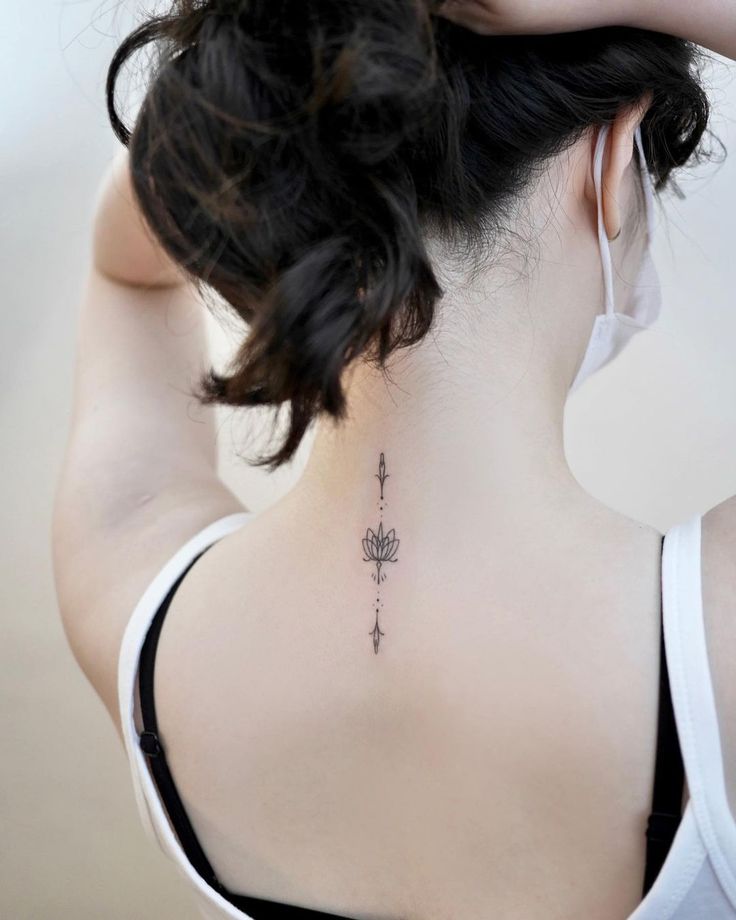 a woman with a tattoo on her back