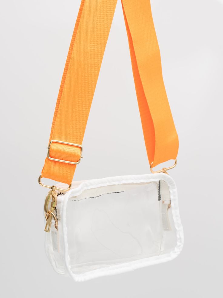 Never go to the stadium without your Clear Crossbody Stadium Bag! Available in 8 poppin' colors, this bag is the perfect way to take your must-haves into the game without the hassle. And thanks to the removable strap, you can even customize your look. Go team! Size: 3.2 x 4.7 x 2 inches Adjustable strap 5 inch Rhinestone Collegiate Team Hair bow sold separately. Import. **Afterpay and Sezzle Purchase Requires $35 Minimum Order. Concert Bag, Concert Bags, Stadium Bag, Go Team, Cancellation Policy, Orange Bag, Purple Gold, Hair Bow, Red Gold