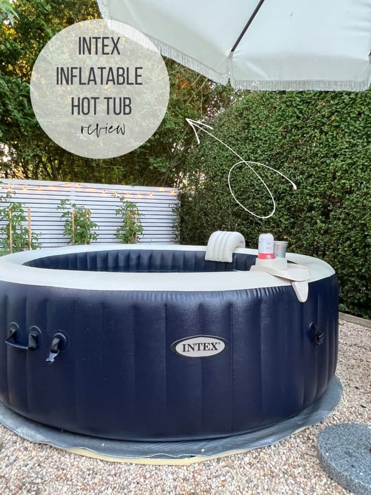 an inflatable hot tub sits outside on gravel