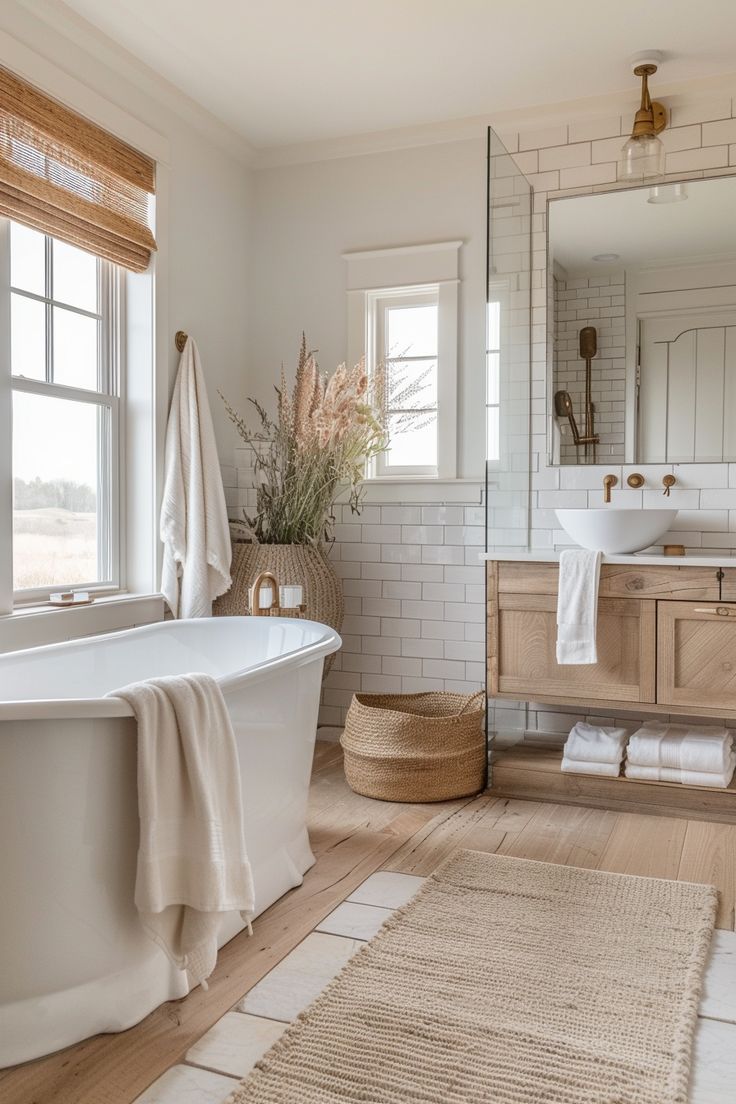 a bathroom with a tub, sink and mirror