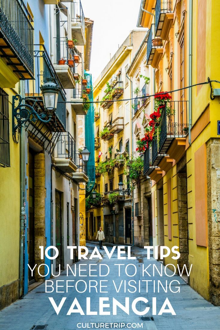 an alleyway with flowers and balconies in the background is featured on this travel guide