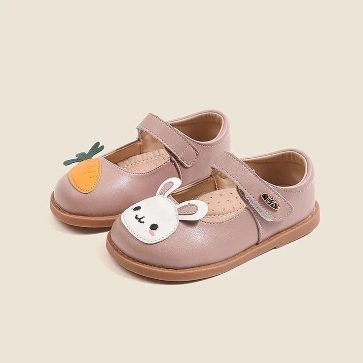 Introducing our Cartoon Rabbit Leather Flat Shoes – the perfect blend of comfort, style, and whimsical charm. Crafted with your little one's comfort in mind, these flat shoes are made from high-quality leather that's gentle on their delicate feet. The star of the show is our adorable cartoon rabbit or carrot design, adding a playful touch to your child's footwear collection. The strap ensures a secure fit, so your little explorer can hop and skip with ease while wearing these delightful shoes. W Pink Leather Flats With Rubber Sole, Pink Closed Toe Ballet Flats For Spring, Pink Leather Closed Toe Shoes With Rubber Sole, Spring Pink Closed Toe Ballet Flats, Pink Leather Mary Janes With Rubber Sole, Pink Mary Janes With Rubber Sole For Spring, Pink Leather Ballet Flats With Leather Sole, Cute Flat Mary Janes For Spring, Spring Leather Shoes With Soft Sole And Flat Heel