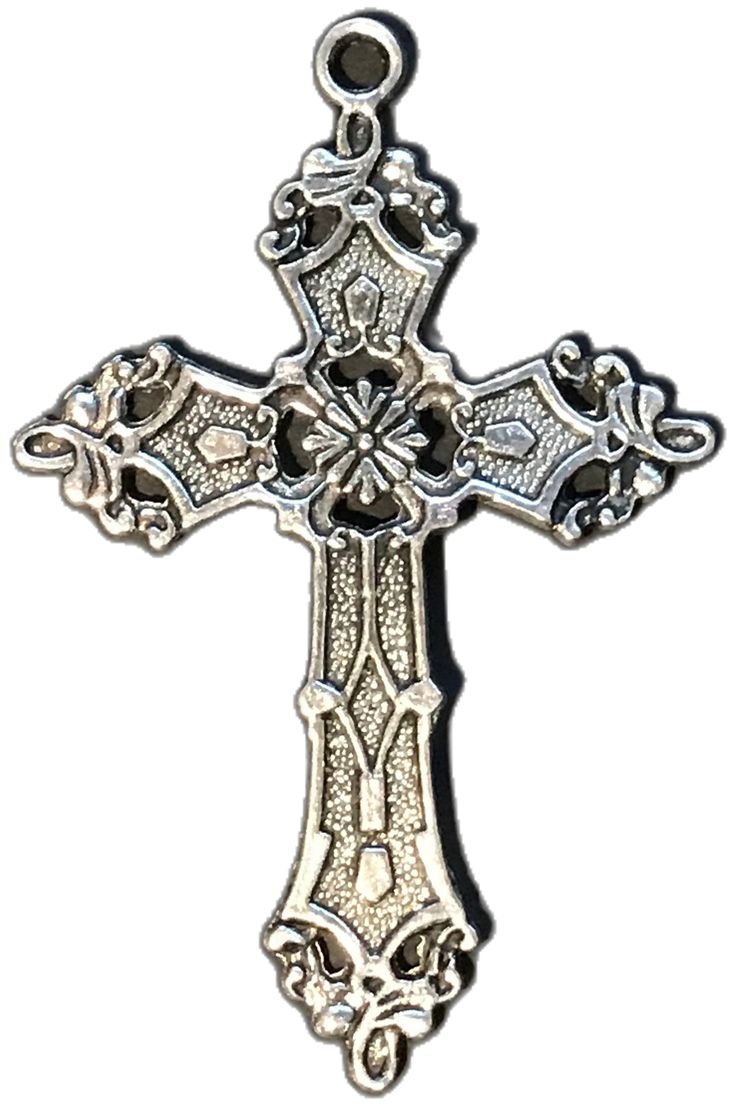 an ornate silver cross on a white background