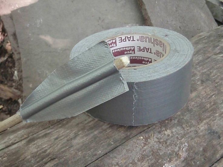 a roll of duct tape sitting on top of a wooden table