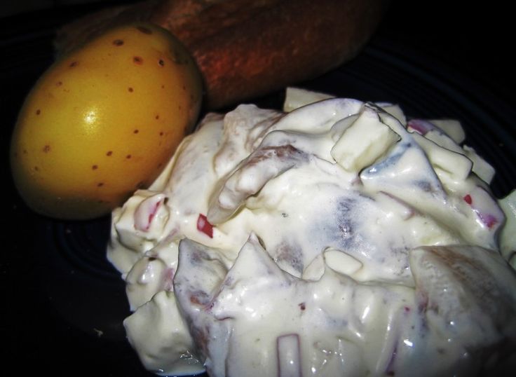 a close up of food on a plate with a banana and other items in the background