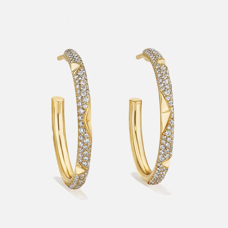 Indulge in luxury with these stunning large hoop earrings, where dazzling diamonds accentuate the octahedron relief design, creating an elegant and captivating allure. For custom requests, please contact us: custom@aetherdiamonds.com. Product Details: 100% recycled 18k gold Diamonds are made from 100% captured carbon B Corp Certified Style Number: E5016 Luxury Hoop Earrings With Pave Setting, Luxury Pave Set Hoop Earrings, Luxury Diamond Hoop Earrings With Pave Setting, Luxury Small Hoop Earrings With Pave Setting, Luxury Yellow Gold Cubic Zirconia Hoop Earrings, Luxury Hoop Jewelry With Pave Setting, Luxury Hoop Diamond Earrings With Diamond Cut, Luxury Everyday Hoop Earrings With Single Cut Diamonds, Luxury Hoop Diamond Earrings With Single Cut