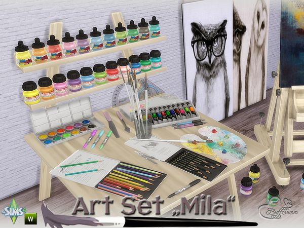 an artist's desk with art supplies on it