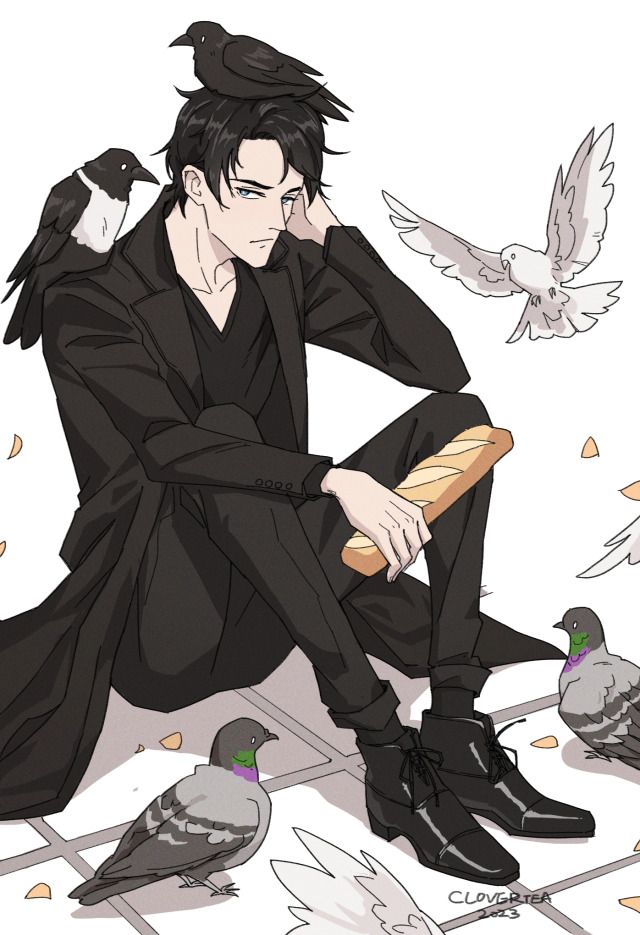 a man sitting on the ground next to pigeons and holding a bread in his hand