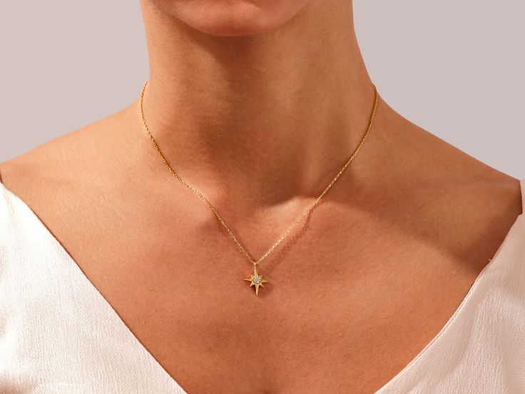 Navigate your style with the timeless elegance of our North Star Necklace in luxurious 14k Solid Gold. Meticulously crafted, this enchanting piece features a delicate gold chain and a captivating North Star pendant, symbolizing guidance, inspiration, and pursuing one's true path. FEATURES • Made to Order • Height: 16.00 mm • Width: 12.80 mm • Gold Kt: 14k Solid Gold, 18k Solid Gold • Available Gemstones: Diamond, Moissanite • Gemstone Cut: Round • Diamond Color - Clarity: G Color - SI1 Clarity • Dainty Yellow Gold Star Of David Necklace, Elegant Star Charm Pendant Jewelry, Elegant Star-shaped Clavicle Necklace, Elegant Star Of David Charm Necklace With Delicate Chain, Elegant Yellow Gold Star Of David Charm Necklace, Yellow Gold Star Of David Jewelry With Delicate Chain, Yellow Gold Fine Jewelry Necklace With Star Charm, Elegant Gold Star Of David Charm Necklace, Elegant 14k Gold Jewelry With Star Charm