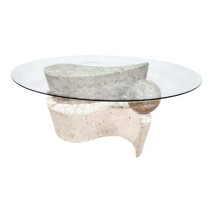 a glass table with two rocks on it and a rock in front of the top