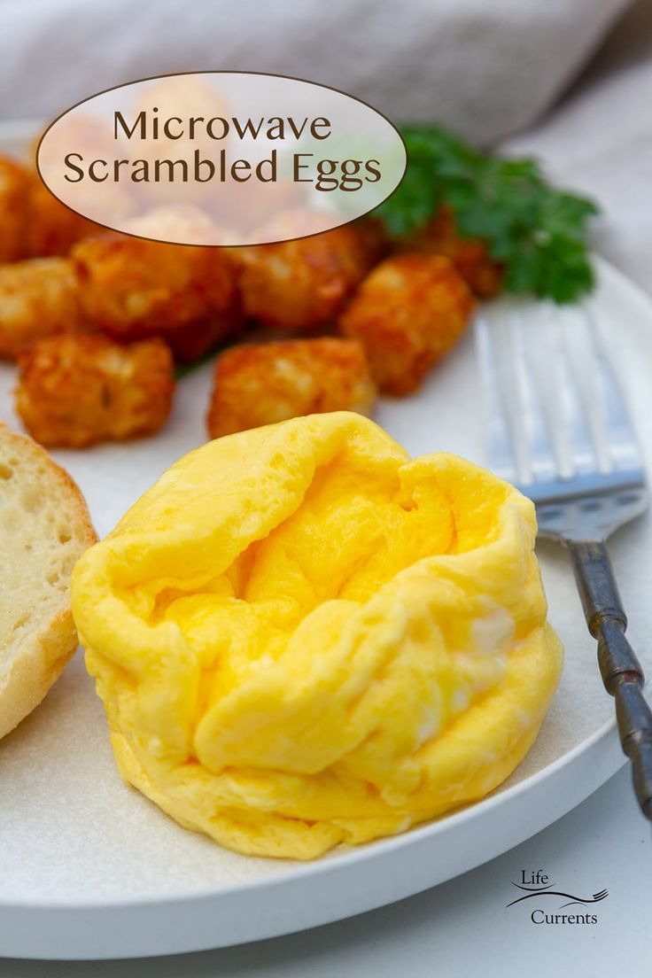 a white plate topped with eggs and bread