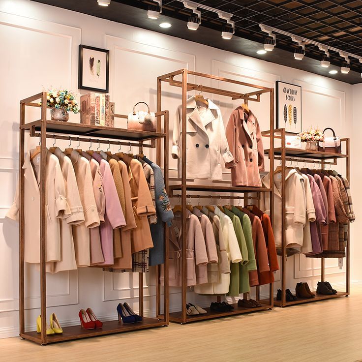 the clothing rack is filled with clothes and shoes