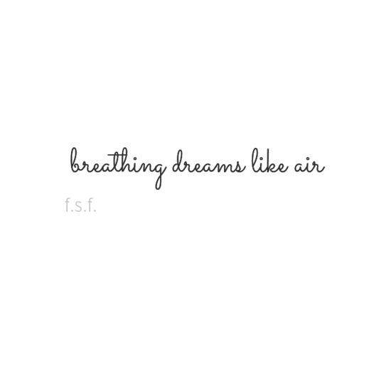 the words breathing dreams like air are written in black ink