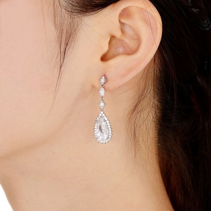 These gorgeous sterling silver cubic zirconia pear drop earrings are a must-add to your fine jewelry collection. These gorgeous sterling silver cubic zirconia pear drop earrings are a must-add to your fine jewelry collection.Click on this JEWELRY & WATCHES GUIDE to learn about fit, styles, materials and more! Length: 37 mm Backings: post Metal: sterling silver Finish: polished Packaging: boxedSTONE DETAILS Stone type: cubic zirconia Total weight: 3 5/8 ct. Shape: pear, round Setting: prong Pleas Silver Pear-shaped Diamond Earrings With Elegant Design, Silver Diamond Teardrop Earrings, Silver Diamond Teardrop Earrings In Pear Shape, Glamorous Cubic Zirconia Teardrop Earrings Gift, Dazzling Cubic Zirconia Teardrop Crystal Earrings, Diamond Teardrop Crystal Earrings, Dazzling Teardrop Cubic Zirconia Earrings, Teardrop Cubic Zirconia Crystal Earrings, Silver Teardrop Earrings With Elegant Design