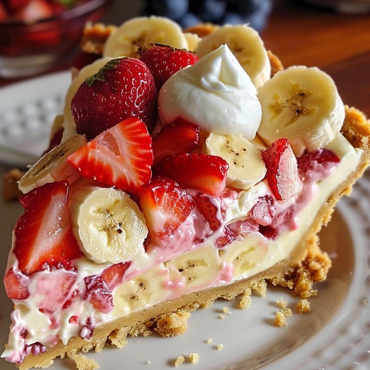 a piece of pie with strawberries and bananas on top