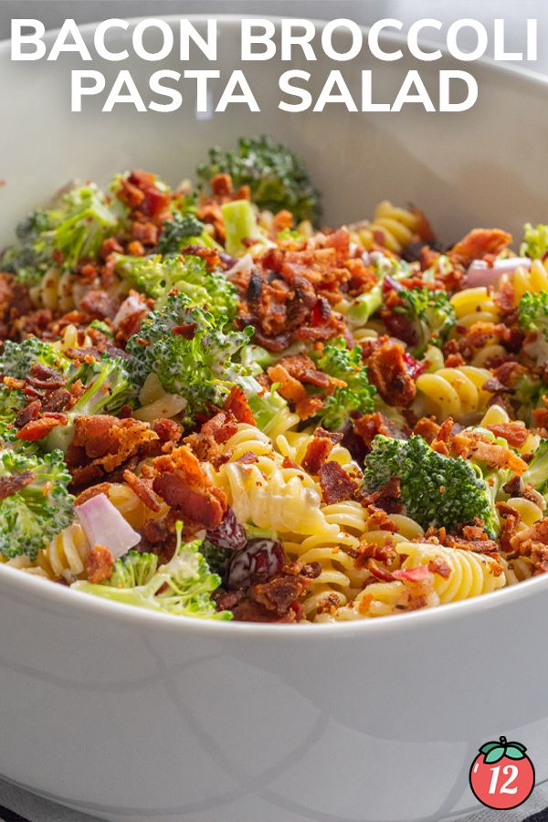 a white bowl filled with pasta and broccoli