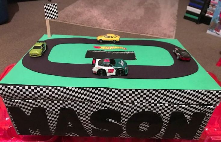 a toy race track with cars on it