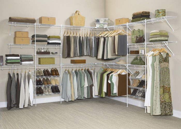 an organized closet with clothes and shoes