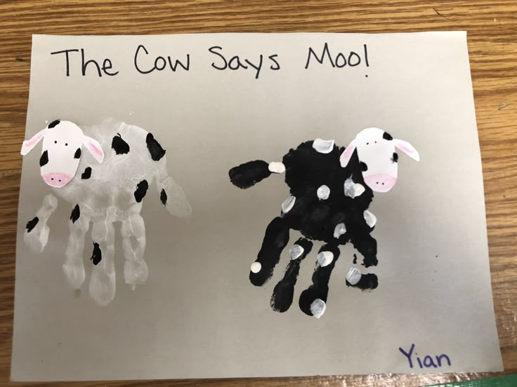 two handprints of sheep and a cow with the words the cow says mol