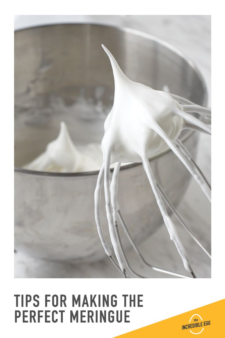 a whisk in a metal bowl with the words tips for making the perfect meringue