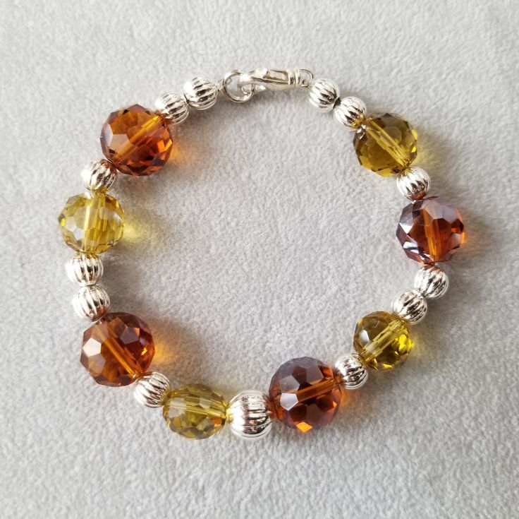 Beautiful Beaded Bracelet With Citron And Warm Orange Glass Beads Alternating With Textured Silver Beads. Handmade By Susan G. Silver Clasp. Never Worn. Great For A Gift! Will Come In A Decorative Gift Bag. Yellow Czech Glass Bracelets With Round Beads, Elegant Yellow Crystal Bracelet With Round Beads, Yellow Faceted Beads Bracelet, Elegant Yellow Bracelets With Faceted Beads, Elegant Yellow Bracelet With Faceted Beads, Yellow Bracelets With Colorful Round Beads, Yellow Bracelets With Colorful Beads, Elegant Yellow Beaded Bracelet With Faceted Beads, Elegant Yellow Polished Beaded Bracelets