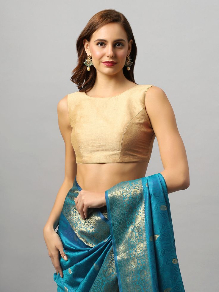 Product Features: Color: Gold Fabric: Art Silk Neck Style: Round Neck Sleeve Length: Sleeveless Closure: Back Open Padded: Yes Occasion: Festivewear, Casual Product Type: Blouse Disclaimer: There will be slight difference in digital to actual image Blue Sleeveless Blouse Piece For Summer, Sleeveless Blue Blouse Piece For Summer, Sleeveless Blue Blouse Piece, Blue Sleeveless Blouse Piece, Blue Unstitched Blouse Piece, Unstitched Sleeveless Blue Blouse Piece, Blue Sleeveless Unstitched Blouse Piece, Blue Sleeveless Unstitched Blouse Top, Sleeveless Padded Blue Blouse