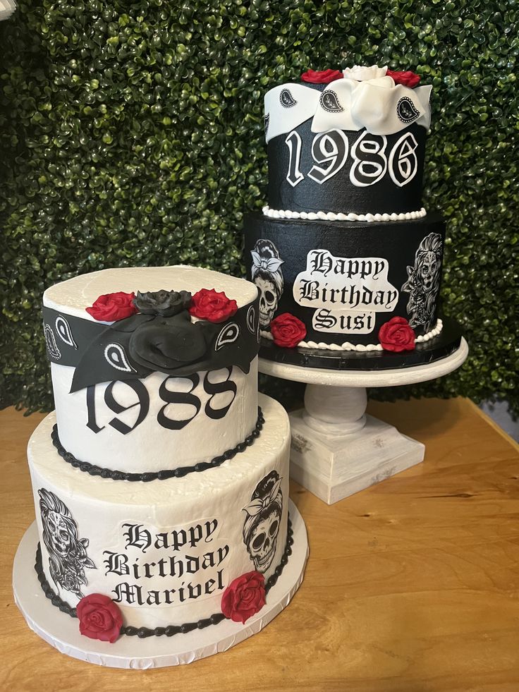 three tiered cakes decorated with roses and skulls are sitting on top of a table