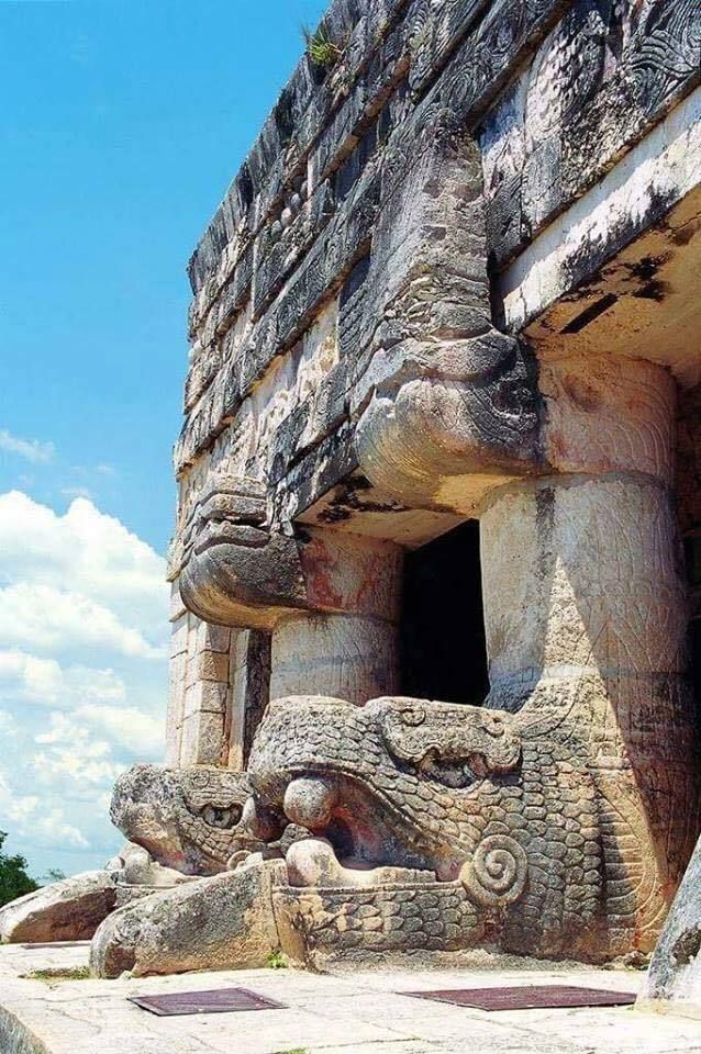 an ancient building with carvings on the outside