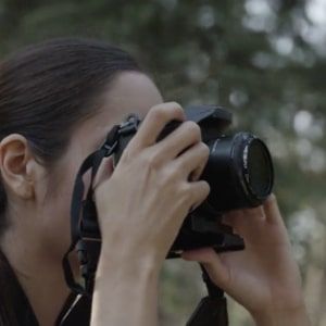 a woman is taking pictures with her camera