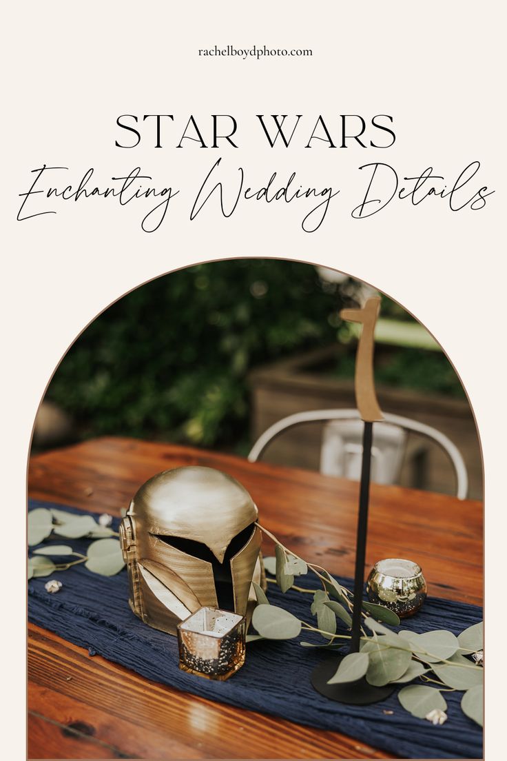 star wars wedding details with gold helmets and greenery on a wooden table in the background