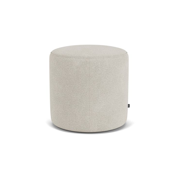 a white stool with a black button on it