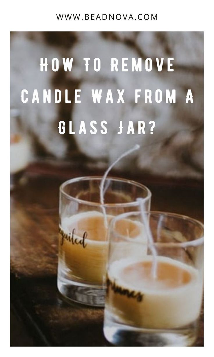 three glasses filled with candles sitting on top of a table