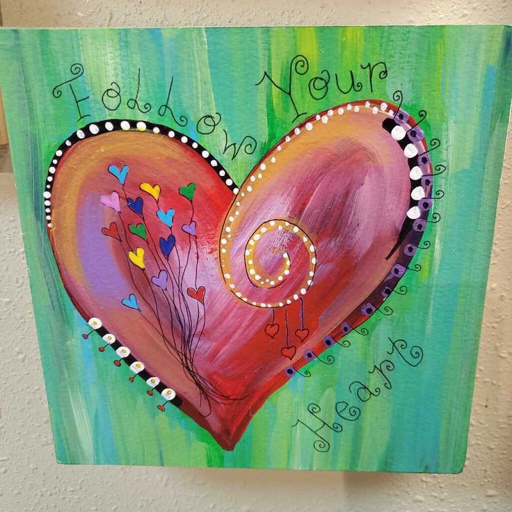 a painting of a heart with flowers on it