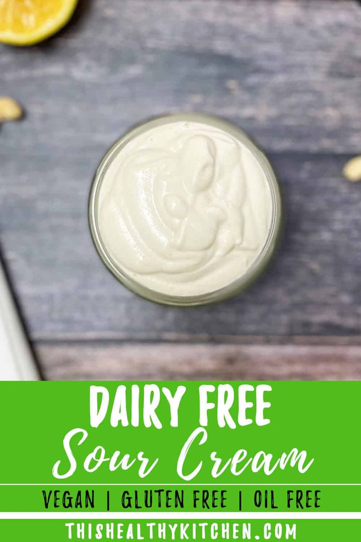 dairy - free sour cream in a small glass jar with an orange slice on the side