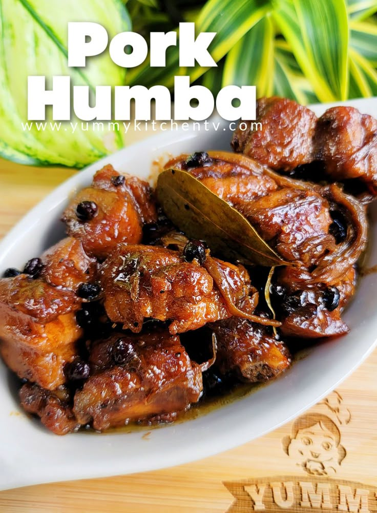 pork humba with olives in a white bowl