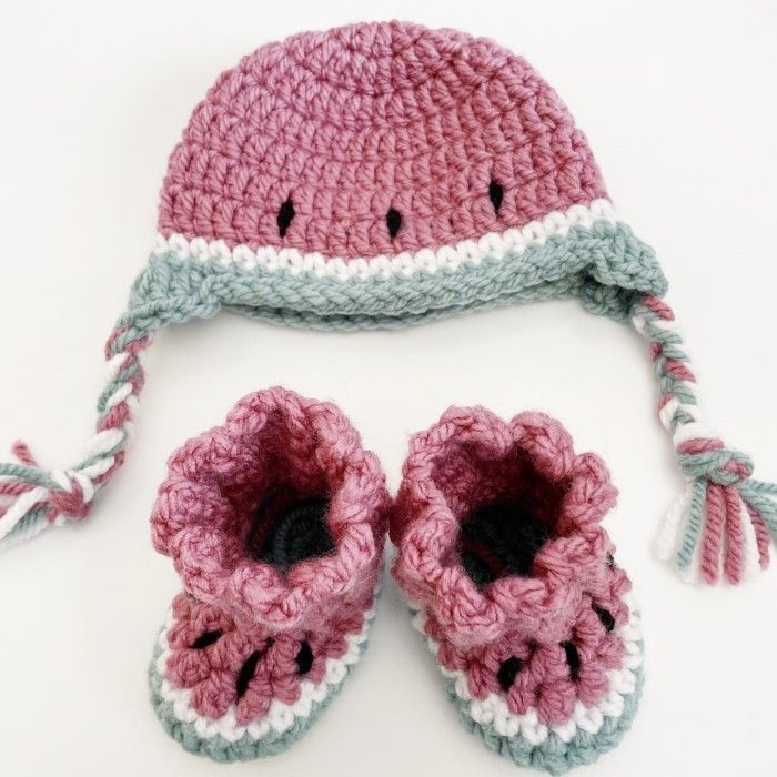 a crocheted hat and pair of baby shoes