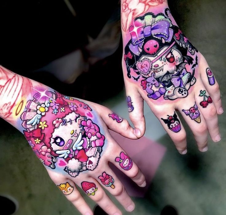 two girls with tattoos on their hands are holding onto each other's arms and fingers