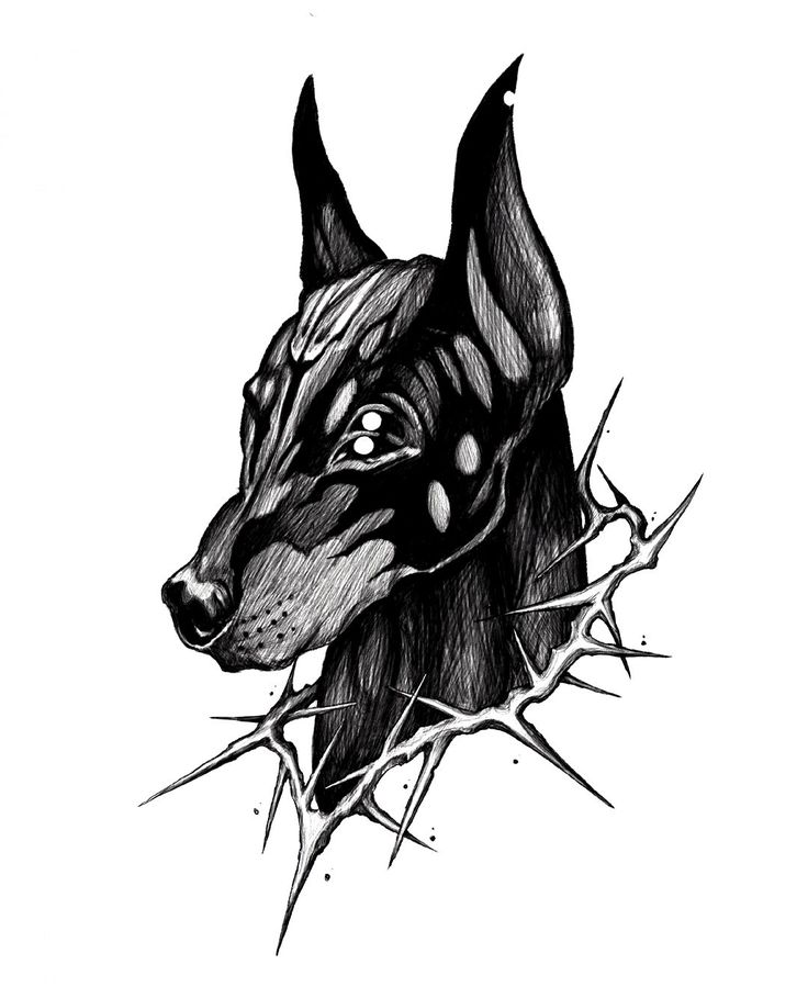 a black and white drawing of a dog's head with thorns around it