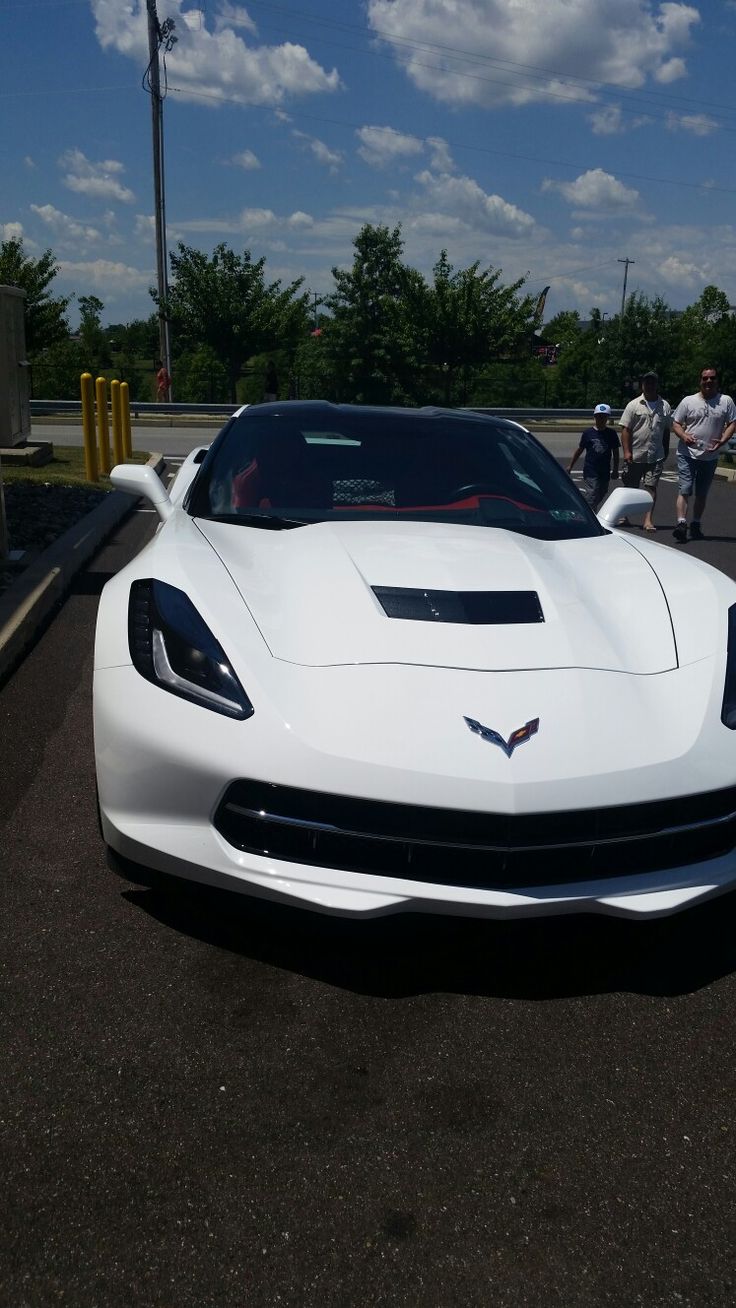 a white car parked in a parking lot