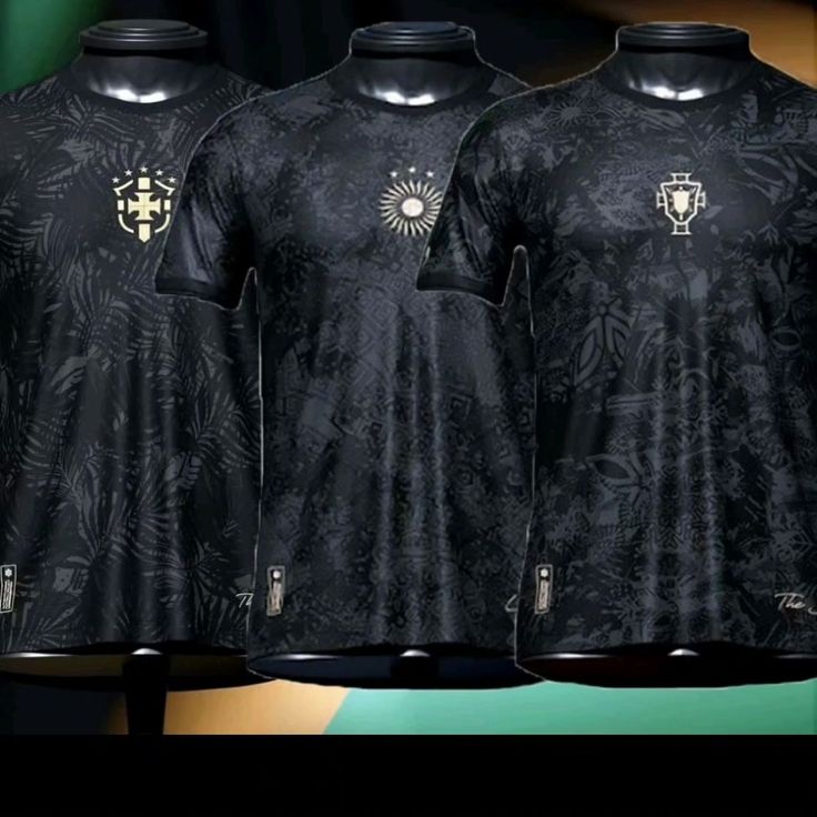 three black shirts with gold designs on them are shown in front of a green and yellow background