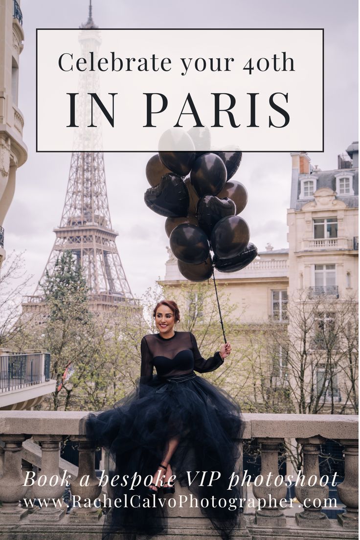 a woman in black dress holding balloons with the eiffel tower in the background